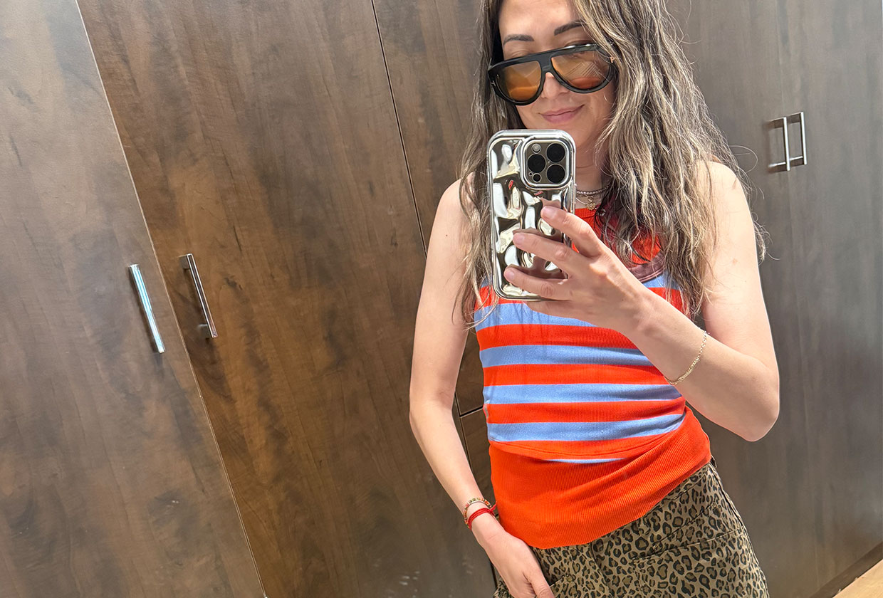 Caroline Maguire wearing leopard pants with a sleeveless striped top.