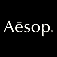 Aesop logo in white text on a black background.