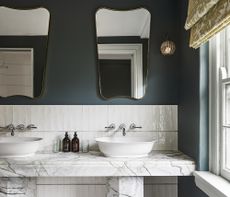marble bathroom with blue walls