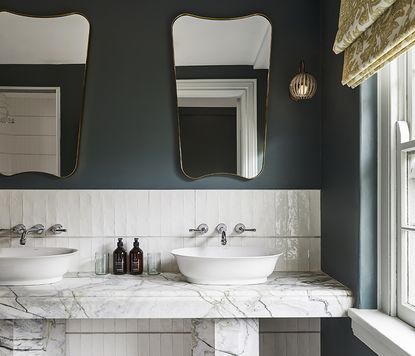 marble bathroom with blue walls