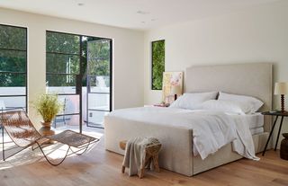 bedroom with white walls steel windows day bed lounger