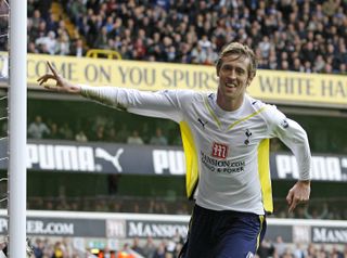 Peter Crouch celebrates a goal for Tottenham against Portsmouth in March 2010.