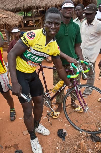 Alphonse checks his tires in preparation for his second-ever race on paved roads