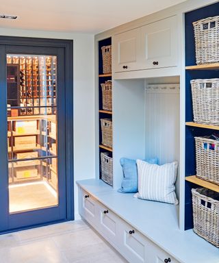 Mud room in blue with seating and storage