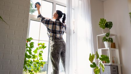 woman cleaning windows