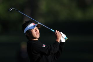 Hideki Matsuyama plays an iron shot