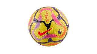 A yellow football with small black, red and purple patterns on it has a red Nike tick in the centre and a small purple lion's head.