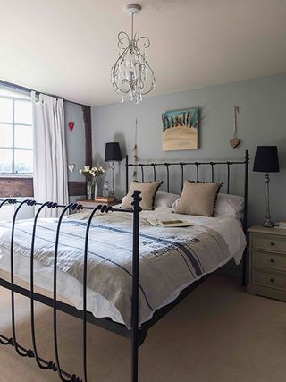 bedroom with brass bedstead in 16th-century home