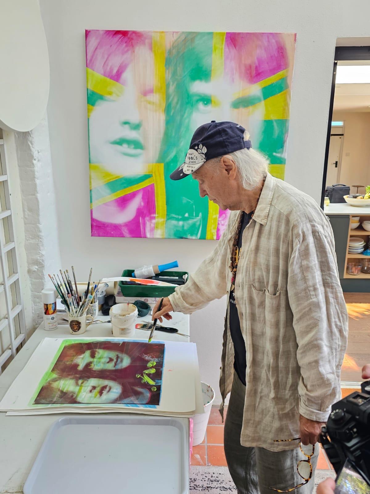 an image of Dave Davies working on one of the paintings in the Brothers exhibition