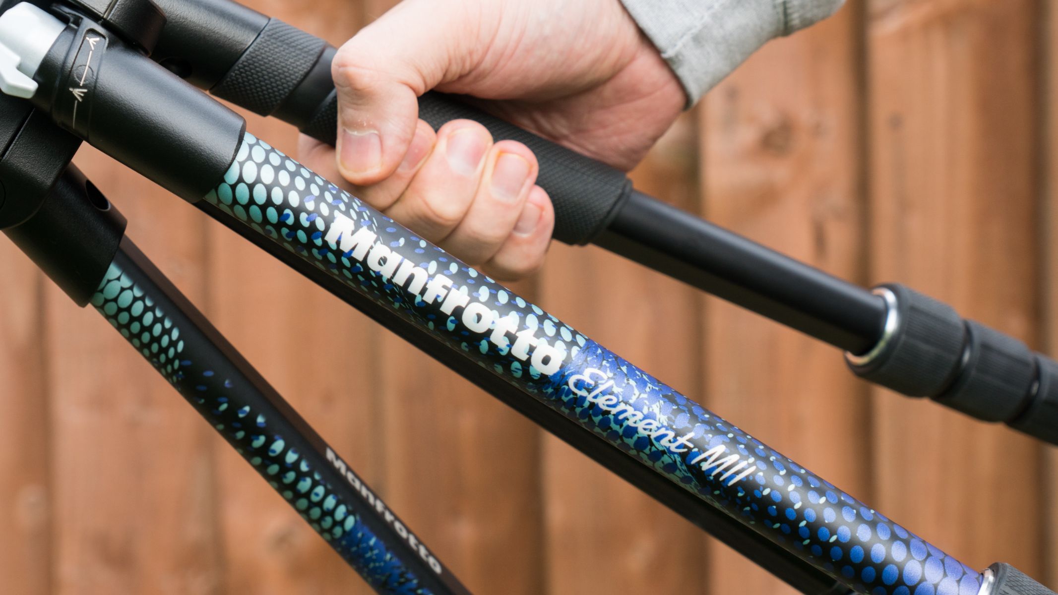 Person holding the tripod rubber grip on the legs