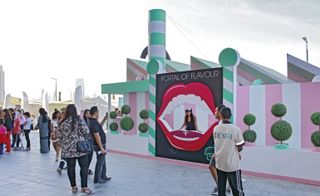 Bompass and Par stand at the Dubai Design District. The stand is turquoise and pink.