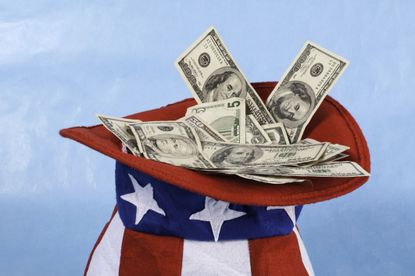 US currency in Uncle Sam's hat for taxes