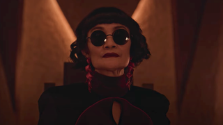 Asian woman wearing sunglasses and dangling earrings in Netflix's Nightmares and Daydreams