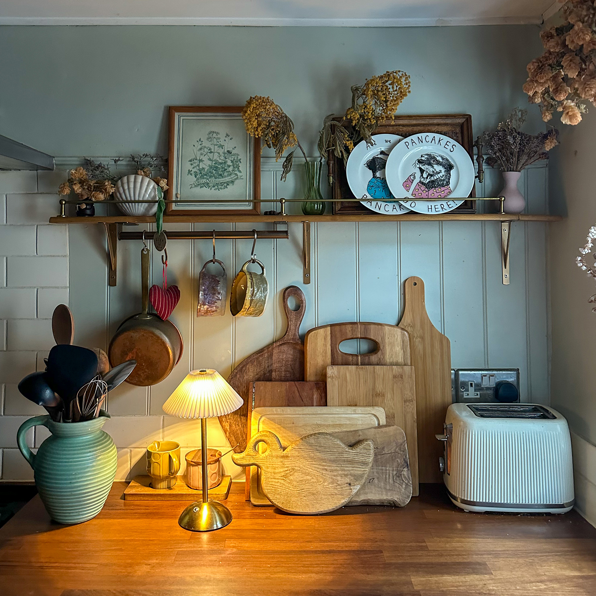 kitchen with a warm table lamp on the counter