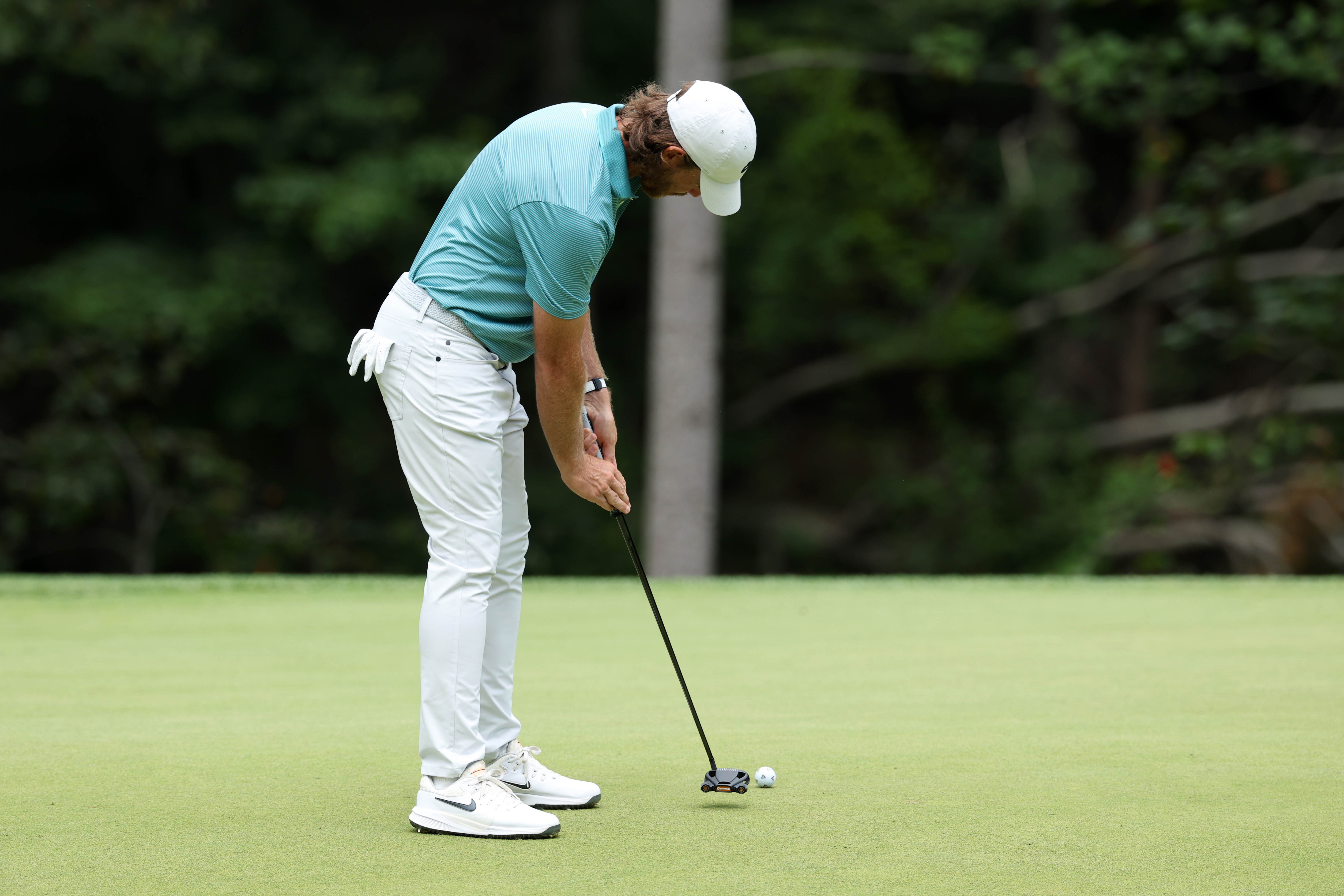 Tommy Fleetwood on the green putting
