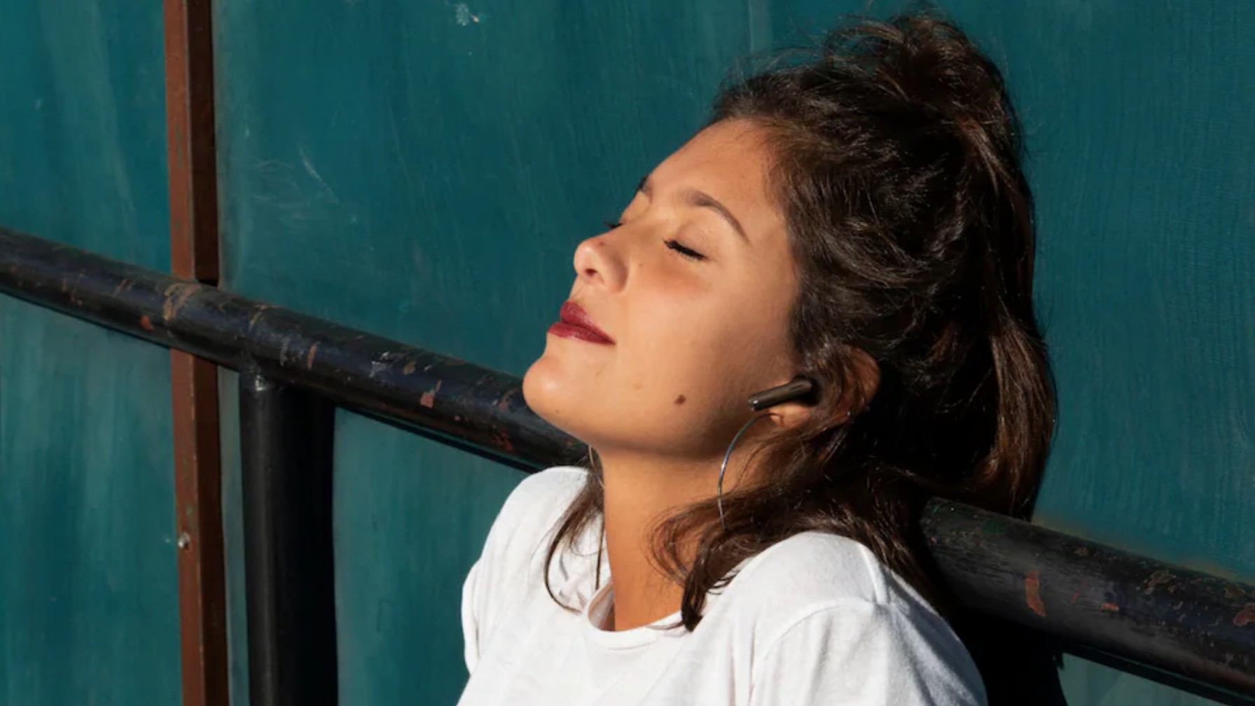 Person wearing JBL Tune 245NC earbuds