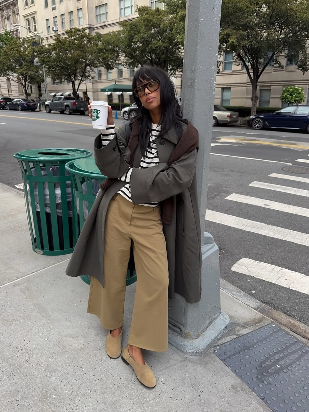 Influencer Amaka Hamelijnck wearing wide-leg trousers, breton t-shirt and ballet flats.