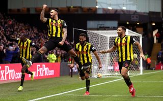 Andre Gray goes airborne to celebrate scoring against Everton