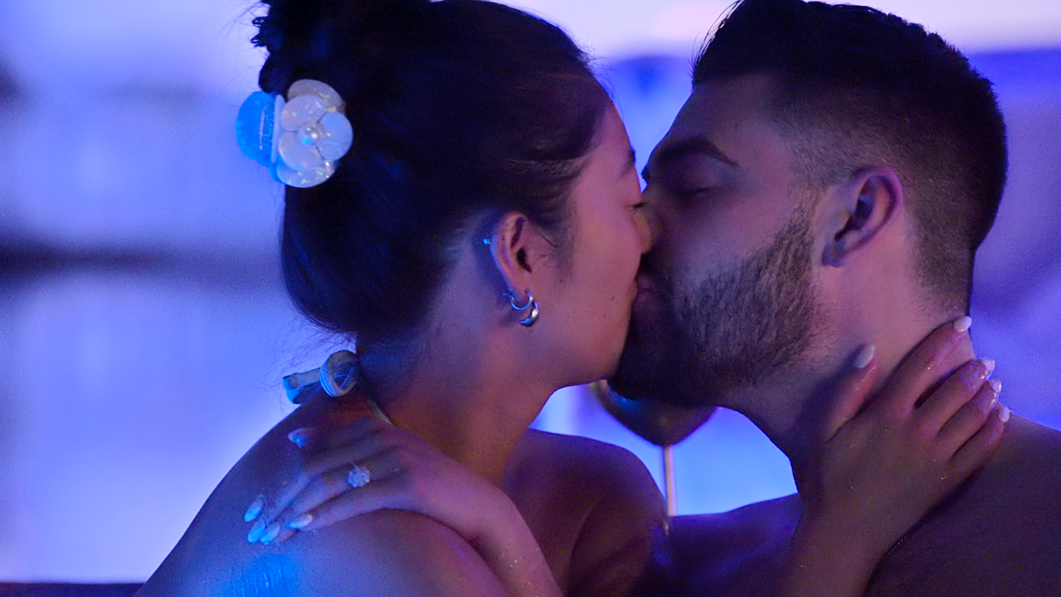 emma betsinger and mike gibney kiss while in a pool at night on vacation in cabo in love is blind season 10
