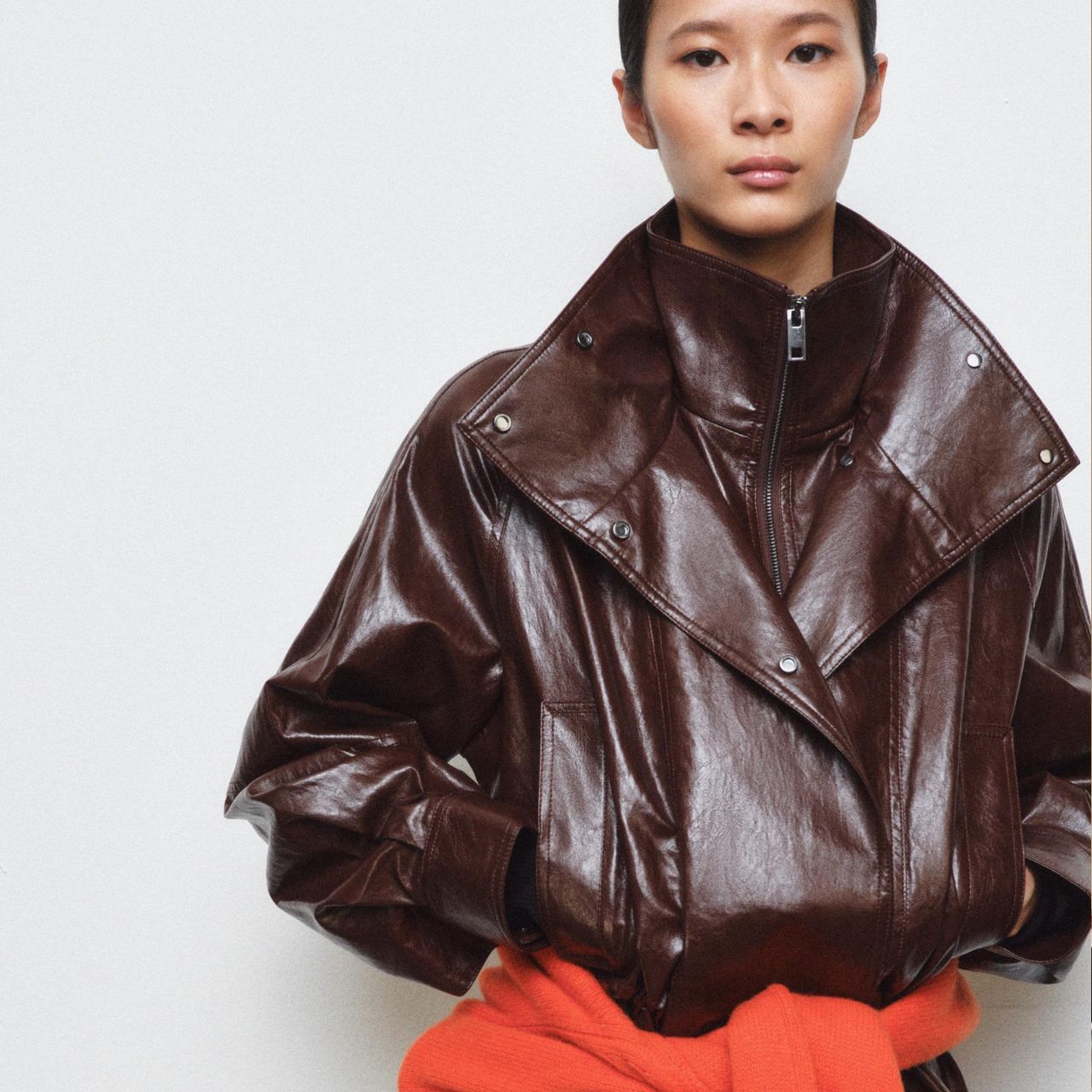 A model wearing a brown jacket from Zara.