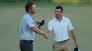 Talor Gooch and Rory McIlroy shake hands at the 2022 Arnold Palmer Invitational