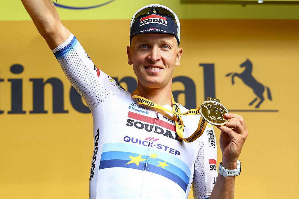 Belgian Tim Merlier of Soudal Quick-Step celebrates on the podium after winning the third stage of the 2025 Tour de France cycling, from Valenciennes to Dunkerque (178 km) on Monday 07 July 2025 in France. The 112th edition of the Tour de France starts on Saturday 5 July in Lille, France, and will finish in Paris, France on the 27th of July. BELGA PHOTO DAVID PINTENS (Photo by DAVID PINTENS / BELGA MAG / Belga via AFP) (Photo by DAVID PINTENS/BELGA MAG/AFP via Getty Images)