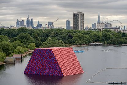 The London Mastaba, 2016-18, by Christo and Jeanne-Claude, with a view of London in the background