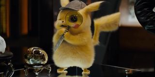 Pikachu holding magnifying glass