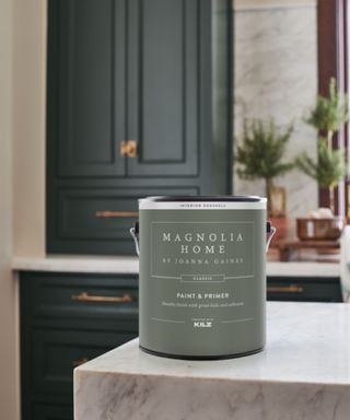 A Magnolia Home paint bucket on a kitchen countertop