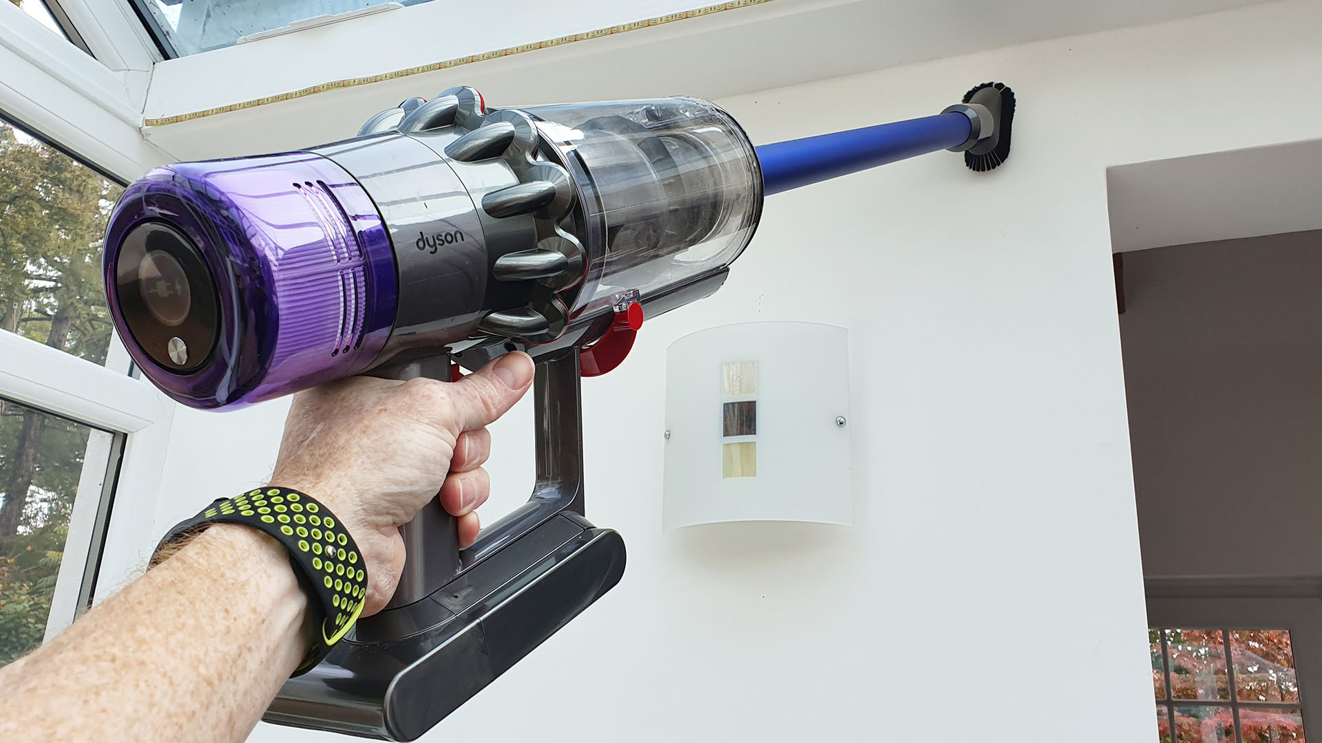 Dyson V11 vacuum cleaner being used overhead