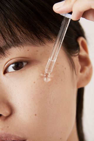 serum being dropped on face