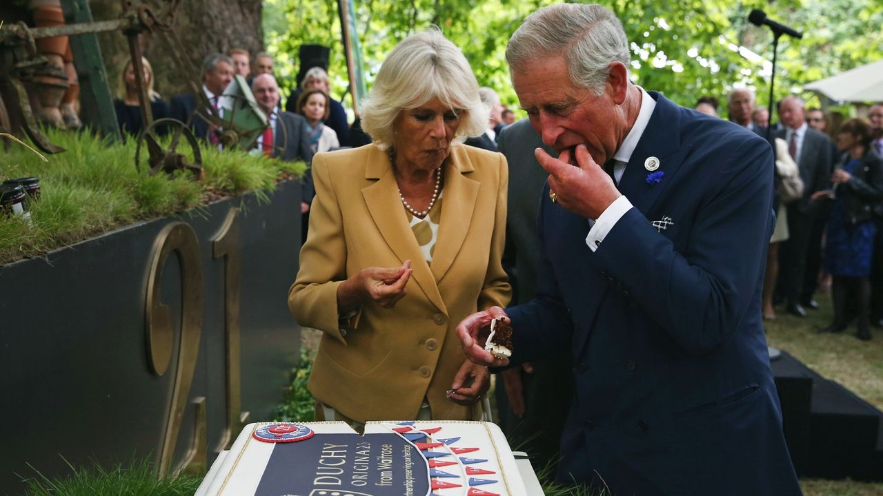 King Charles and Queen Camilla eating