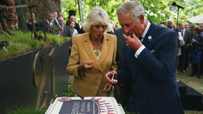 King Charles and Queen Camilla eating