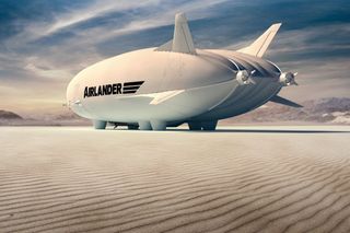A photo of the Airlander 10 landed in the middle of a picturesque desert.