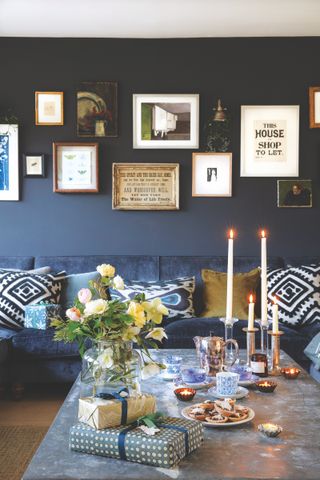 snug with navy blue wall and gallery wall