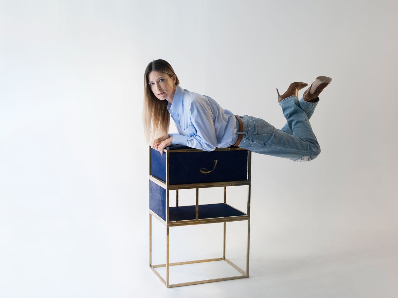 A woman in blue shirt.