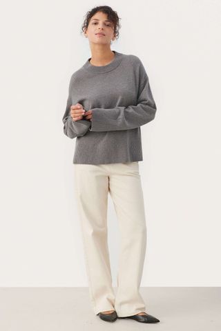 grey jumpers woman wearing crewneck knit with trousers and flats