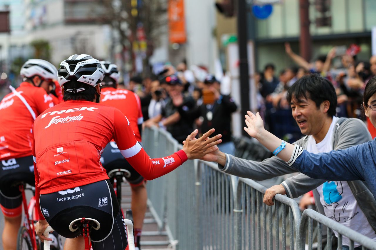 High-fiving fans