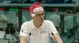 Arianespace Chief Executive Stephane Israel gets into the holiday spirit following the successful Dec. 21 launch of an Ariane 5 carrying satellites for Embratel Star One and Sky Perfect JSAT. Credit: video still of Arianespace launch broadcast.