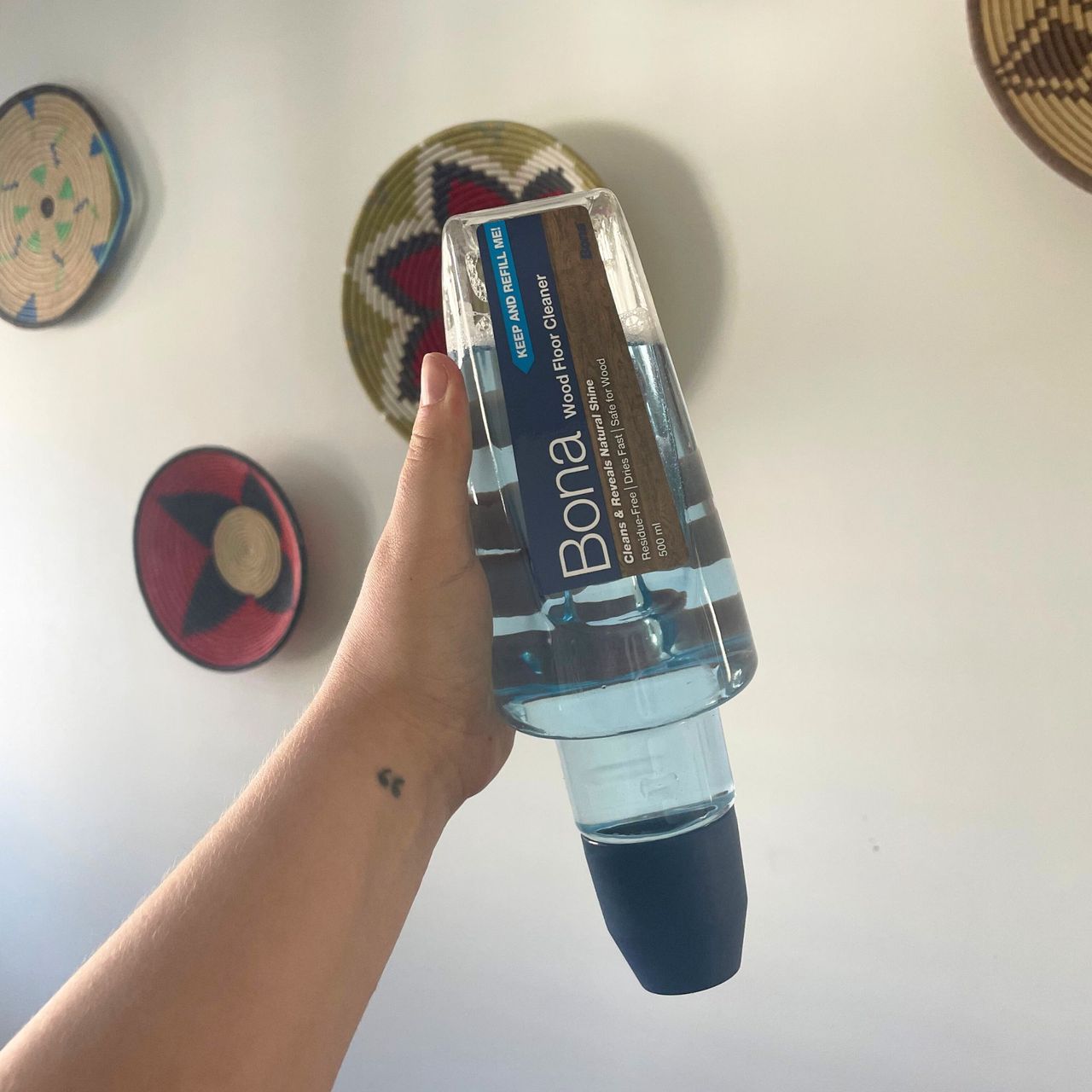 Bona Spray Mop Air cleaning solution held up in the air