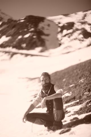 Archaeologist Ludovic Slimak on a snowy mountain.
