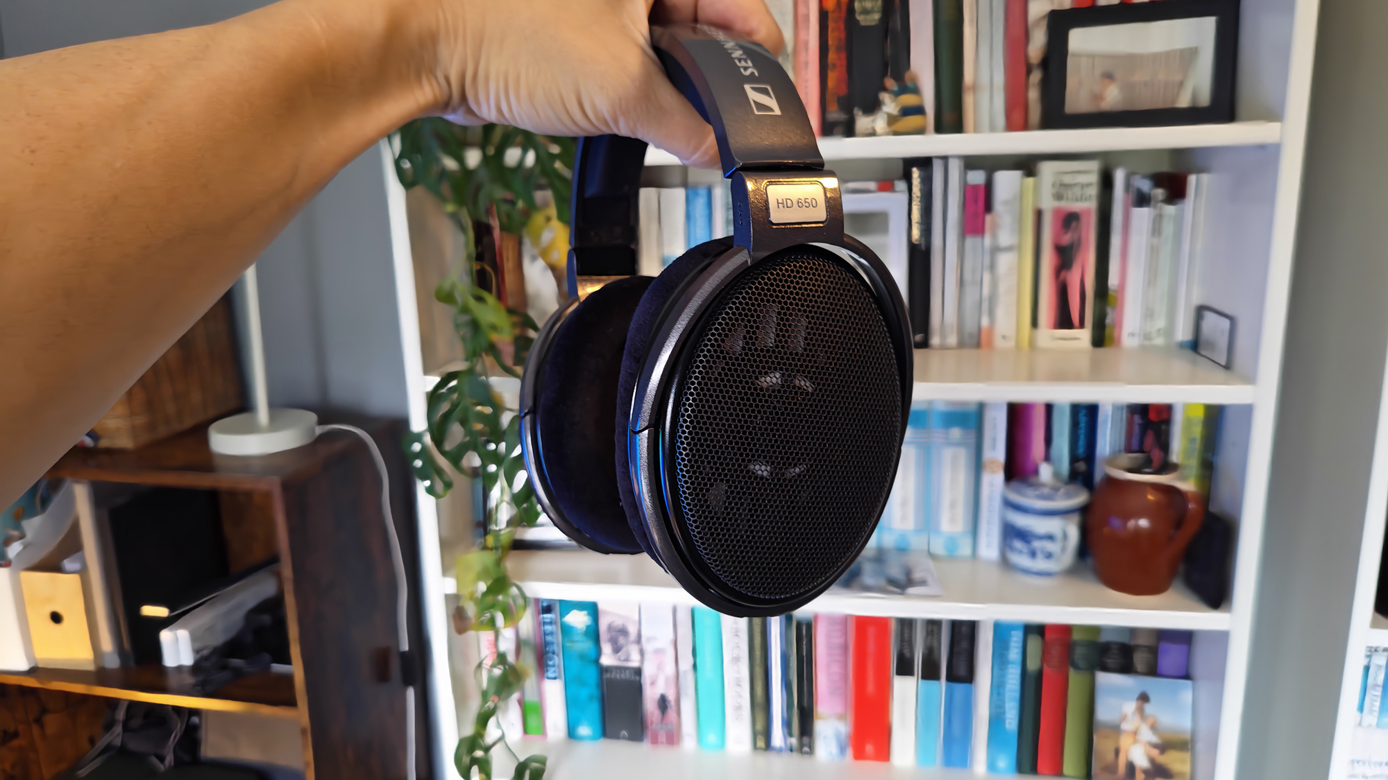 A selection of photos of the HD 650 headphones in a home office.