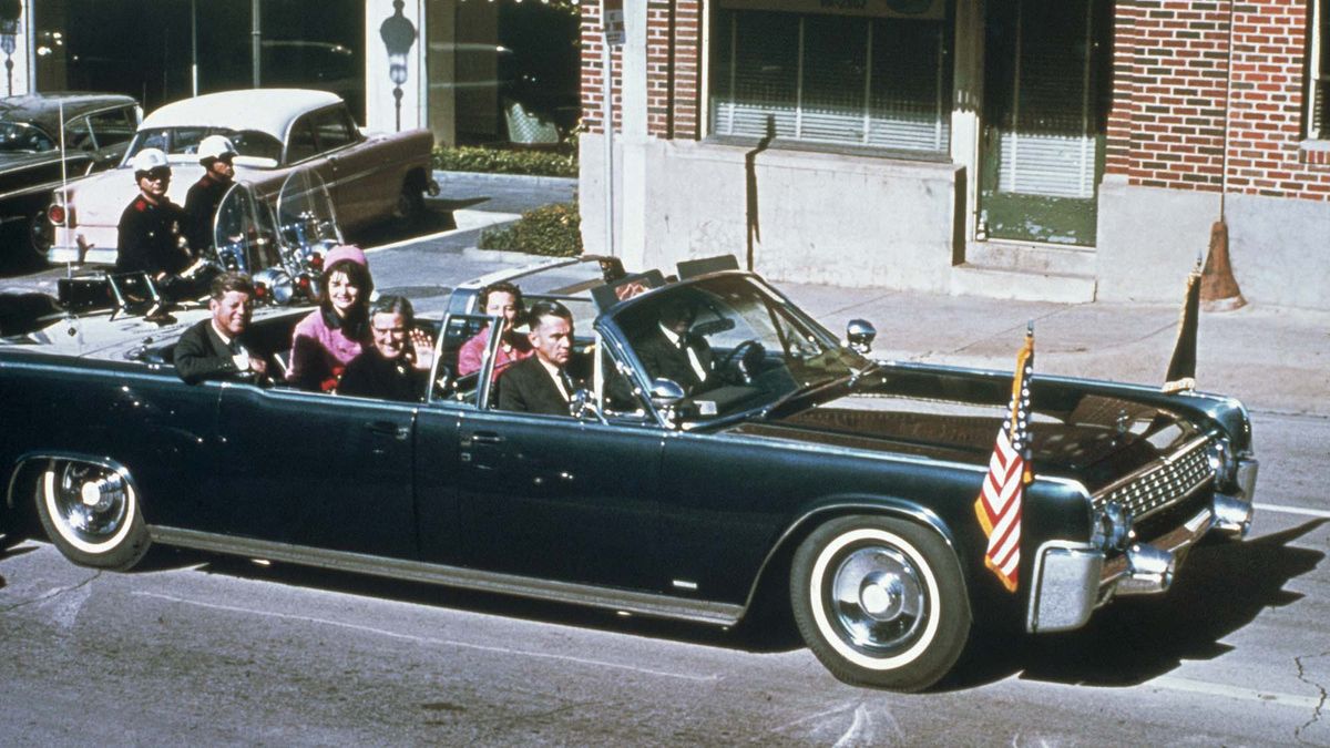 President Kennedy and First Lady Jackie Kennedy riding in a vehicle on the day of the president&#039;s assassination.