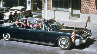 President Kennedy and First Lady Jackie Kennedy riding in a vehicle on the day of the president's assassination.