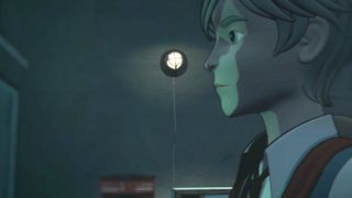 A young man looking at something in a dark room