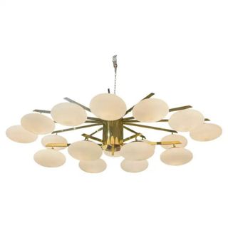 A gold mid-century modern light fixture from 1stDibs