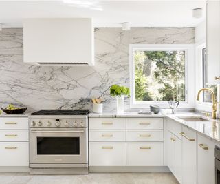 white kitchen marble kitchen in mid century modern home