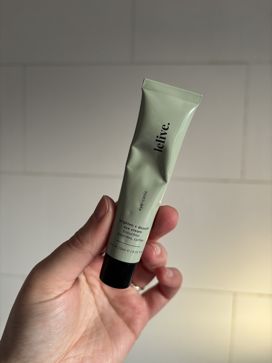 Mica Ricketts holding tube of Lelive Eye-Conic Eye Cream