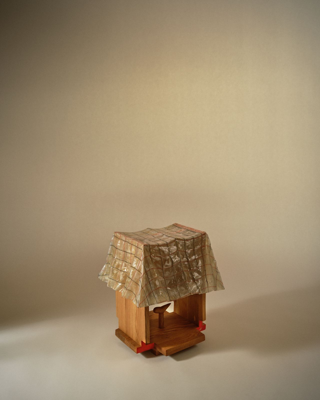 A fanciful envisioned stool features a fantastical, plastic-y seat on a wooden structure.