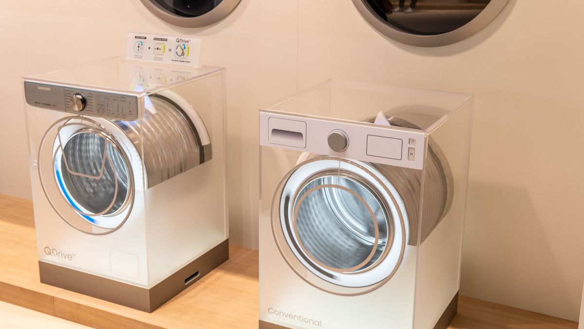 free-standing Samsung washing machine and tumble dryer on display, at Samsung exhibition pavilion showroom, stand at Global Innovations Show IFA 2018,